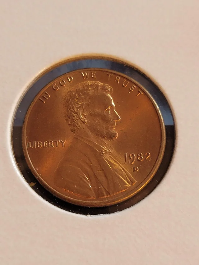 1982-D penny on gram scale showing 3.11 gram copper weight — the key authentication test for the rare 1982-D Small Date Bronze transitional error