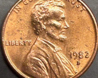 1982-D penny repunched mint mark close-up showing secondary D impression alongside the primary D mint mark